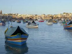 FISHING BOAT LEAVES HARBOUR Stock Footage