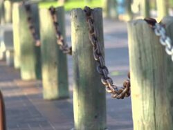 Skateboarder doing an ollie over chains. - Slow Motion - filmed at 240 fps Stock Footage