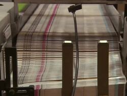 Medium Close Up static - A machine stacks papers in a factory /  Wisconsin, United States Stock Footage