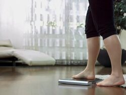 HD DOLLY: Woman Checking The Weight Stock Footage