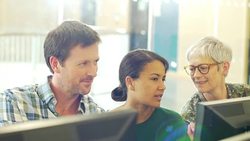 Business people at computers in computer lab Stock Footage