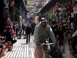 People shopping in a Souk in Marrakech, Morocco, Africa Stock Footage