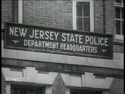 1938: DON'T DO THIS: WS Car passing truck on curve, swerving to miss oncoming car. HIGHWAY PATROL: New Jersey State Police Department Headquarters sign & building exterior. Patrolman studying in training school library, CU Accident illustration. Instructional Video