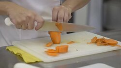 Unrecognisable person peeling a carrot with a knife Stock Footage