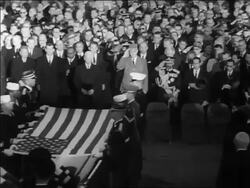 B/W 1963 high angle zoom in to Charles de Gaulle saluting JFK's coffin at burial / Arlington Cemetery / newsreel Stock Footage