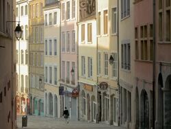 Pentes de la Croix-Rousse,Lyon,Woman walking down hill,PAN Stock Footage