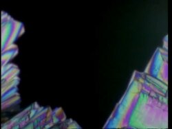 T/L CU colourful crystals grow across frame Stock Footage