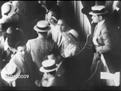 1920s: CHICAGO, ILLINOIS: HA TD WS Italian-American gangster Alphonse Gabriel 'Al' Capone (1899-1947, aka Scarface, snorky) w/ unidentified people at sporting event, possibly race track. 1930 MIAMI MUG SHOT: Al Capone arrest photograph. Instructional Video