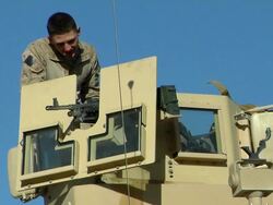 February 2009 MS Soldiers positioning gun at armored vehicle / Kabul, Afghanistan Stock Footage