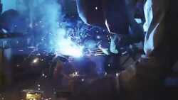 SLO MO MCU DOLLY man welding in home garage Stock Footage