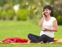 HD: Pregnant Woman Talking On The Phone Stock Footage