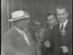 Vice President Richard Nixon talks to Premier Nikita Khrushchev at a meeting. News Clip