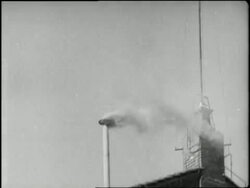 Smoke rising from a small smokestack signals the selection of a new Pope after the death of Pope Pius XII. News Clip