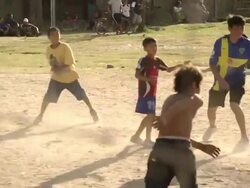 MS TS Shot of kids playing football on ground / Buenos Aires, Argentina Stock Footage