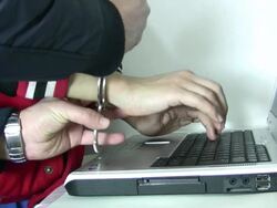 Handcuffed hacker Stock Footage