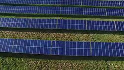 Aerial footage of a field of solar panels near, 4K, shot with a quadcopter or drone Stock Footage