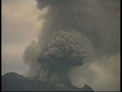 CU grey smoke and ash cloud rising quickly upwards from crater, zoom out to WA, Mount Tunguragua, Ecuador Stock Footage
