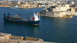 Freight ship entering the harbour Stock Footage