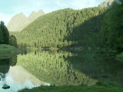 changing seasons from Summer to Fall, lake, Lai da Palpuogna, freezes over Stock Footage