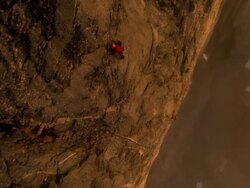 AERIAL, Two climbers on rock face, Fiordland National Park, New Zealand Stock Footage