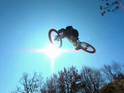 HD Super Slow-Mo: Biker Jumping High In The Air Stock Footage