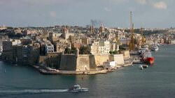 A boat enters the Grand Harbour Stock Footage