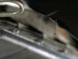CU SLO MO Oil dripping from oil pan / Bergenfield, , New Jersey, USA   Stock Footage