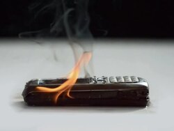 HD Super Slow-Mo: Mobile Phone On Fire Stock Footage