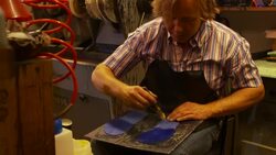 the shoemaker repairs a shoe Stock Footage