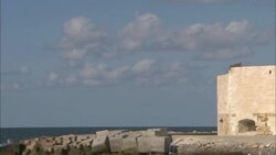 Waves crash at the base of ruins in Alexandria, Egypt. Stock Footage