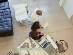 Architects in office with blueprints and design model Stock Footage