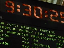 View of clock and ticker above trading floor of New York Stock Exchange New York City Stock Footage