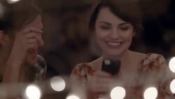 Young couple snap smartphone selfies in Austin caf_ Stock Footage
