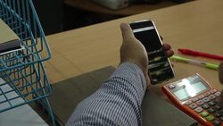 Businessman analyzing data on mobile Stock Footage