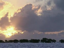 WS Ocean and mountains under setting sun / Great Barrier Reef, Australia  Stock Footage