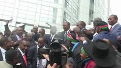 CLEAN : Supporters greet Kenyatta as he leaves the ICC News Clip