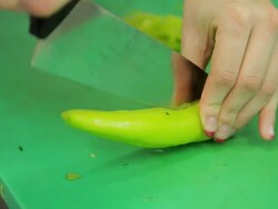 Cuting fresh green pepper Stock Footage