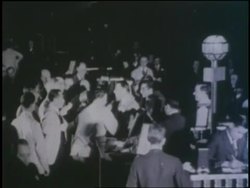 Scraps of paper cover the floor of the New York Stock Exchange after the 1929 crash of the stock market. News Clip