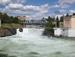 WS Shot of Riverfront Park, Spokane Falls with bridge between Riverfront Park and Canada Island / Spokane, Washington, United States Stock Footage