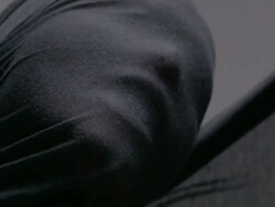 Extreme close up of woman's face wrapped in black flowing cloth Stock Footage