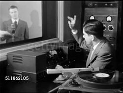 1948: RADIO COMMERCIAL: MS Young male in suit, Disc Jockey, working dials on console in radio control booth, cue announcer. Male standing behind microphone w/ script, SOT 'Claudia is brought to you by Coca-Cola Bottling Company, Springfield.' Instructional Video