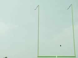 WS, LA, American football ball flying over goal, Staten Island, New York, USA Stock Footage