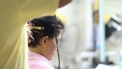 Professional Hairdresser Bleaching Girl's Hair Stock Footage