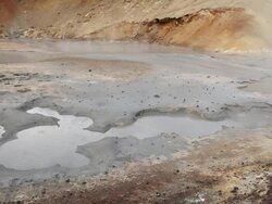MS Geothermally heated pool boiling and steaming in Krysuvik Geothermal area / Reykjanes peninsula, Iceland      Stock Footage