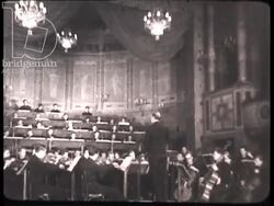 Musicians play for three German officers. France, 1944 Stock Footage