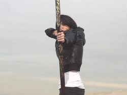 A female archer shooting targets with her bow and arrow.  - Slow Motion - filmed at 480 fps Stock Footage