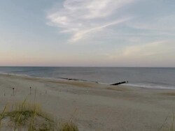 Timelapse shots of sun setting over a beach News Clip