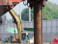 Drilling soil machine on Construction site,Tilt down shot Stock Footage
