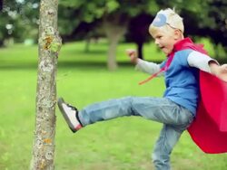 Little superman fighting with the tree. Stock Footage