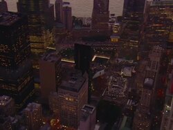 Aerial -Early evening ZO from the 9/11 Memorial area to show full height of the Freedom Tower in lower Manhattan. Stock Footage
